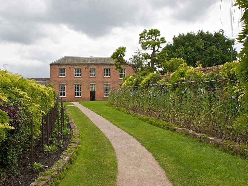 garden path to brick building