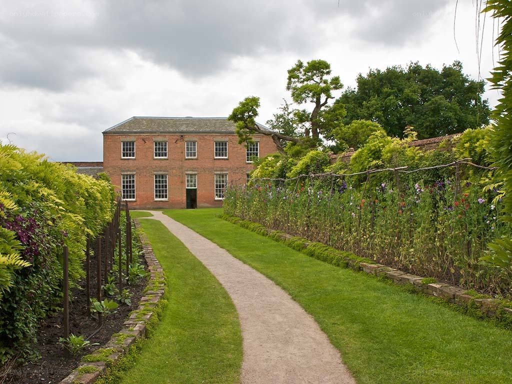 garden path to brick building