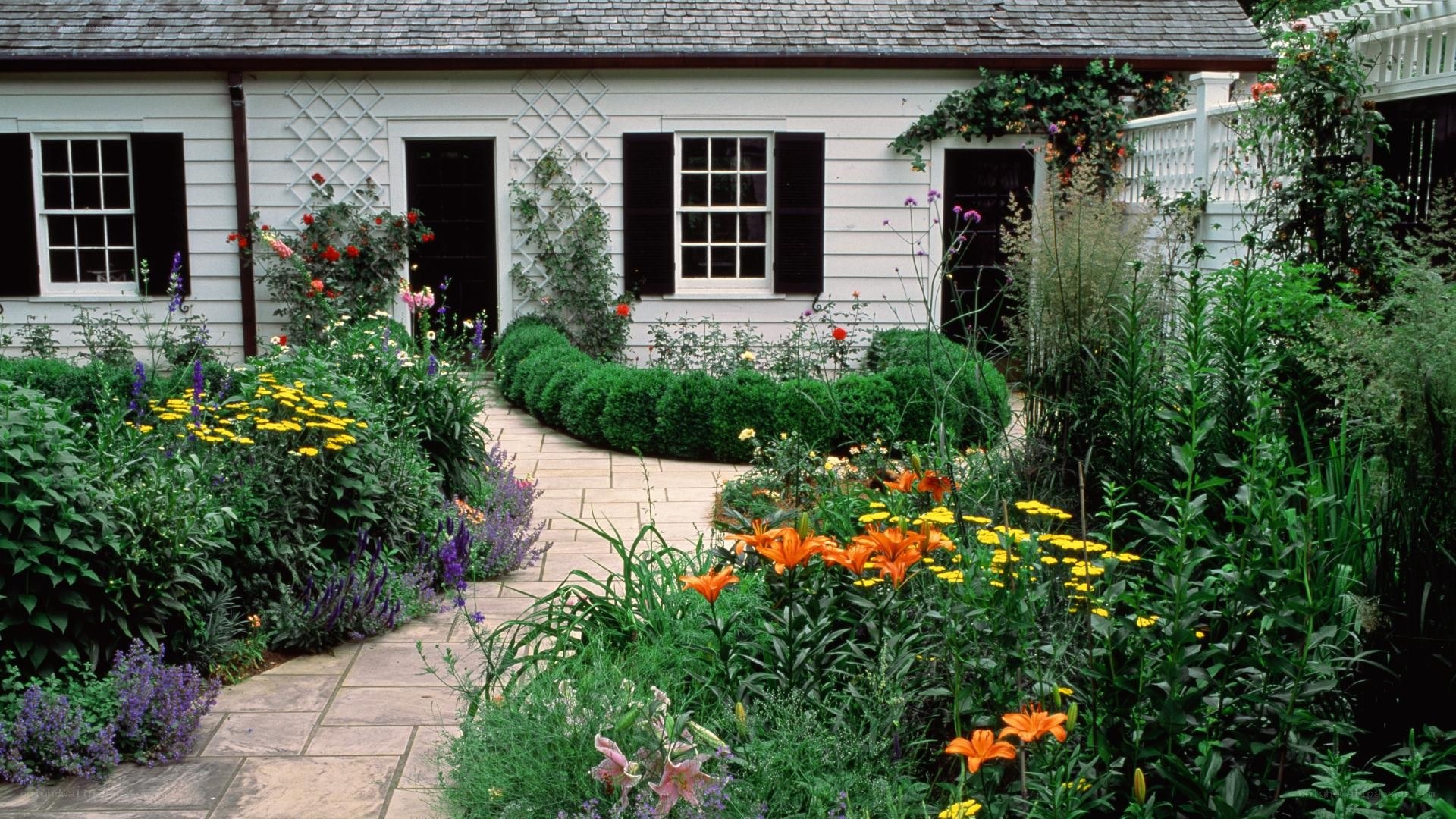 Garden path to white cottage