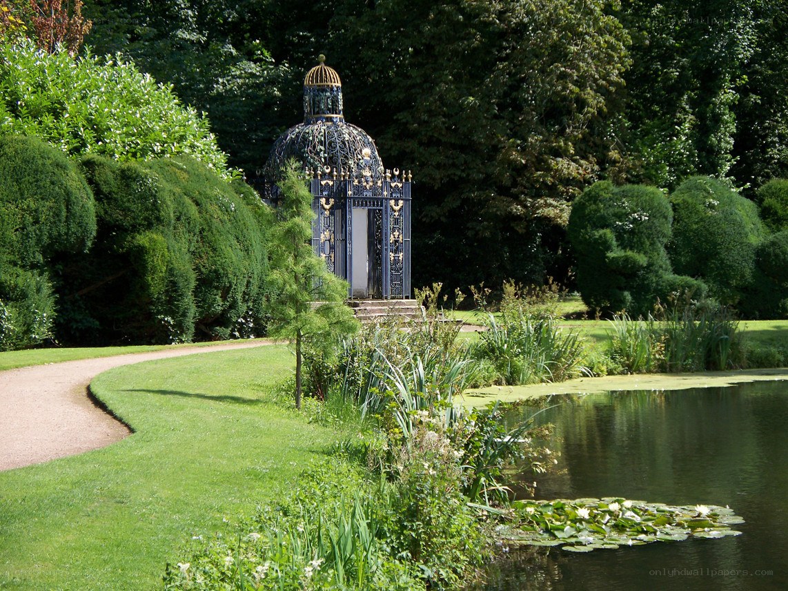 Garden pavilion by a pond