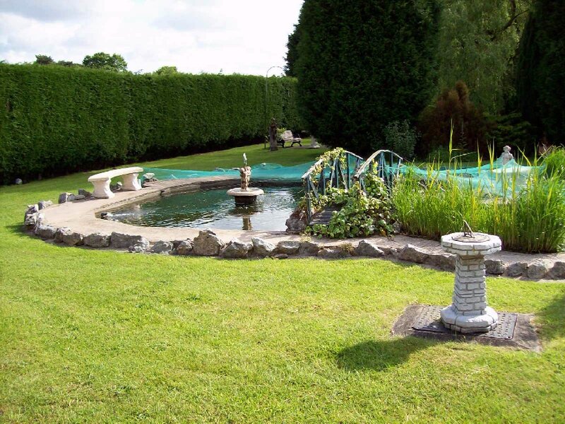 Garden Pond with Fountain — Green, Serene, Afternoon