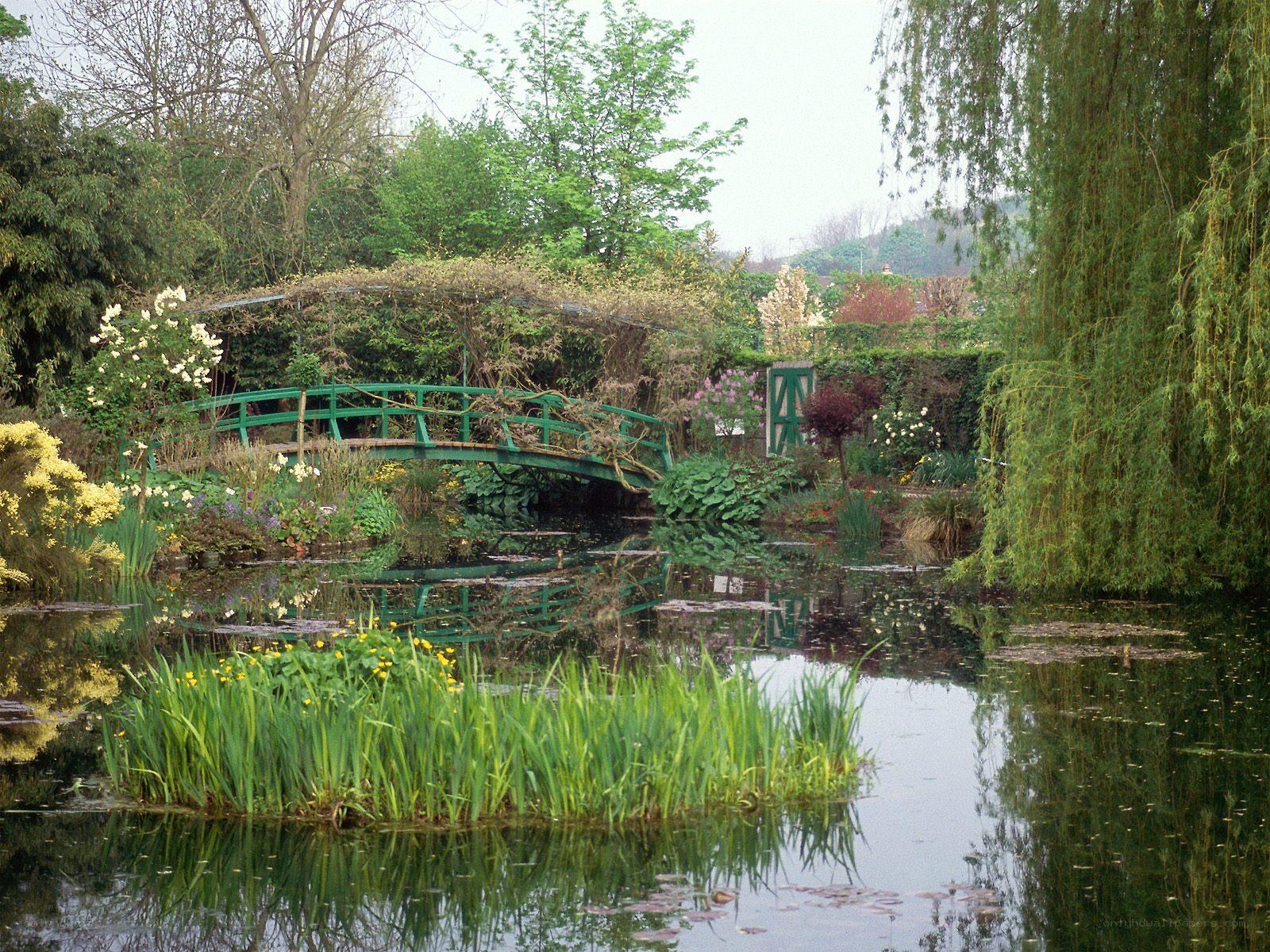 Garden pond with green bridge