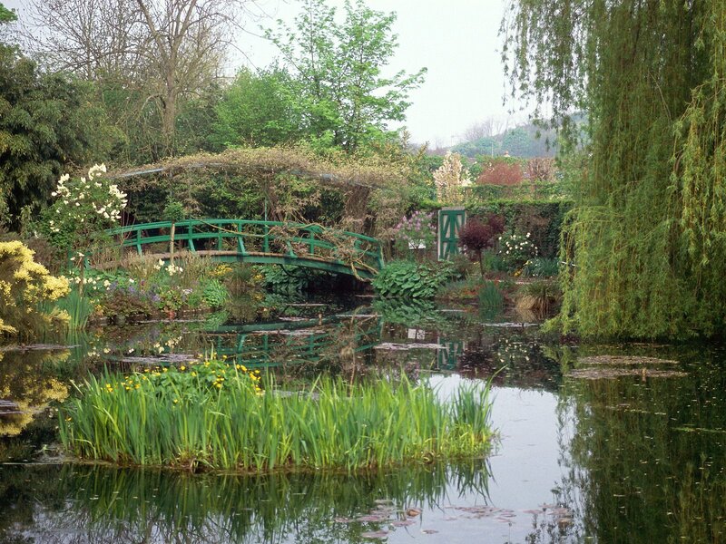 Garden pond with green bridge