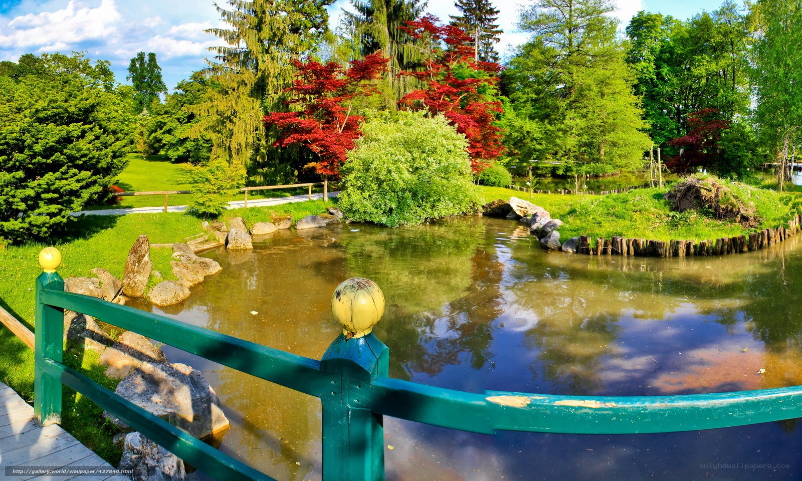 Garden pond with green bridge