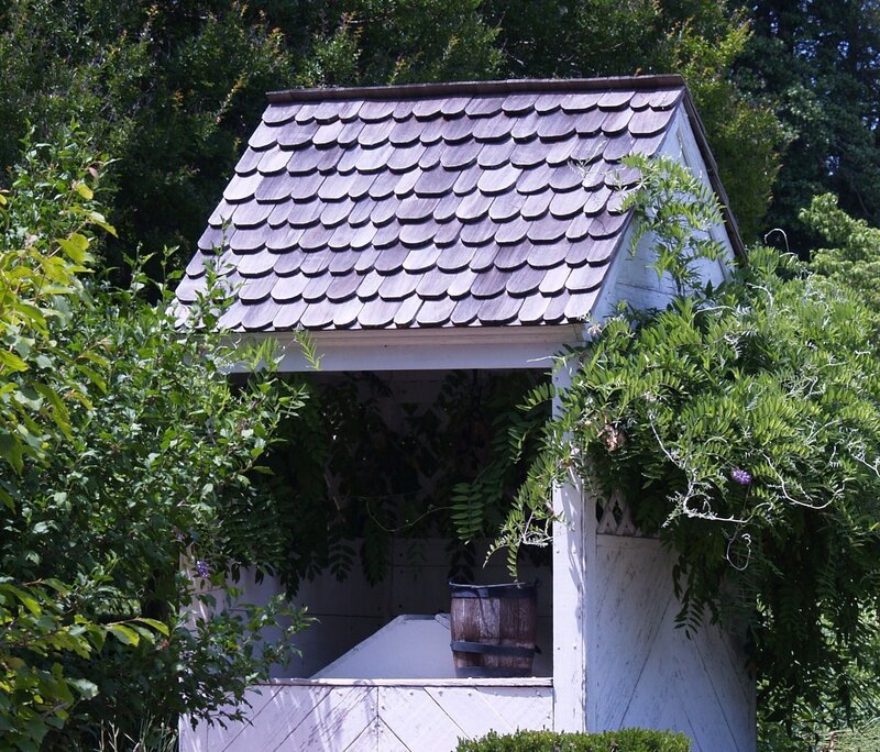 Garden shed with wooden shingles