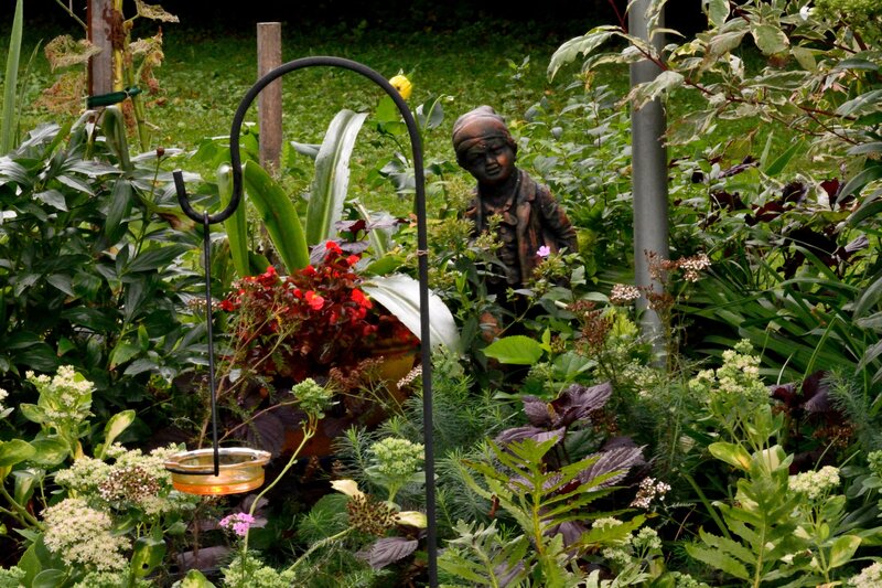 Garden Statue Among Plants