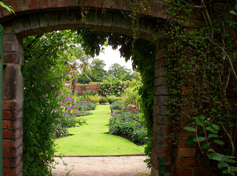 garden through brick archway