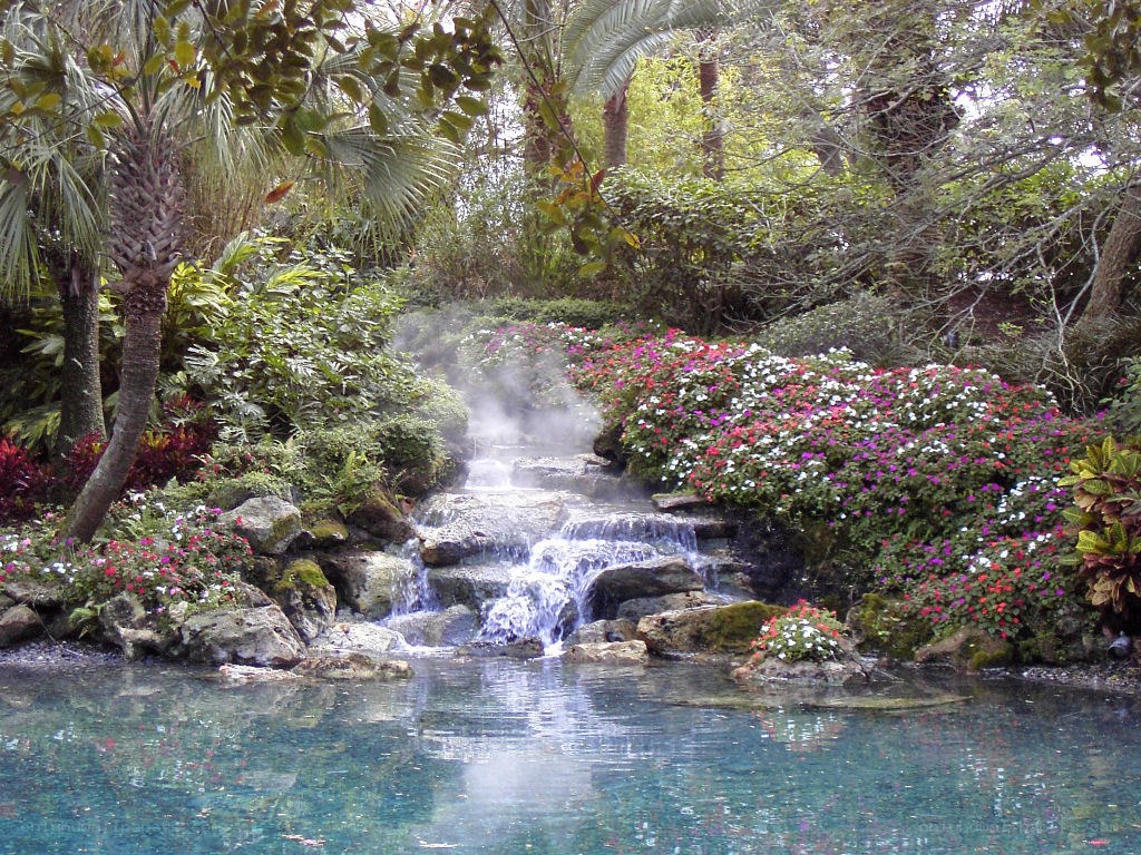 Garden waterfall with flowers