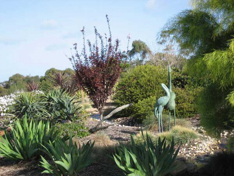 Garden with Bird Sculpture