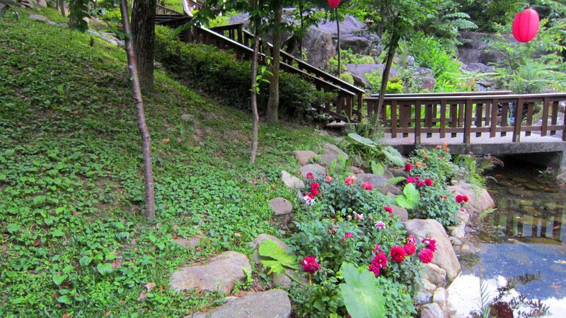 Garden with Flowers and Bridge