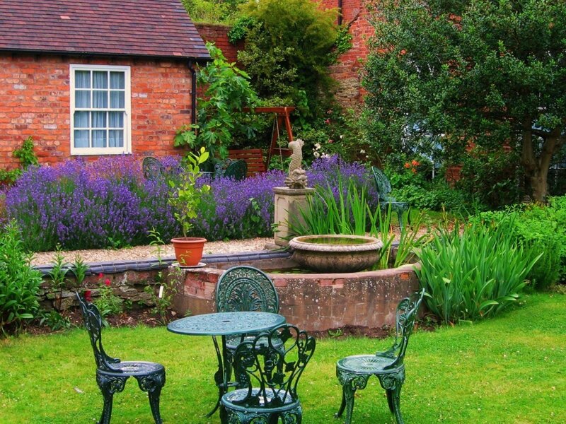 garden with fountain and table