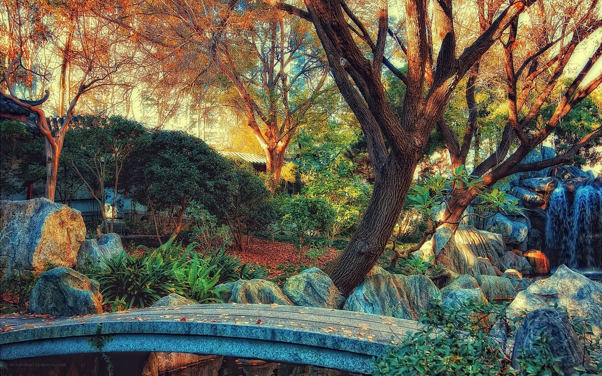 Garden with stone bridge and waterfall