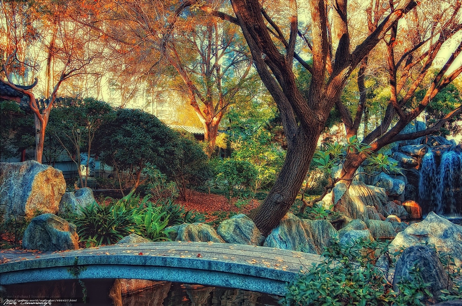 Garden with stone bridge and waterfall