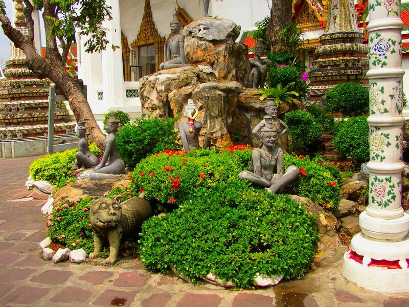 Garden with stone statues and temple