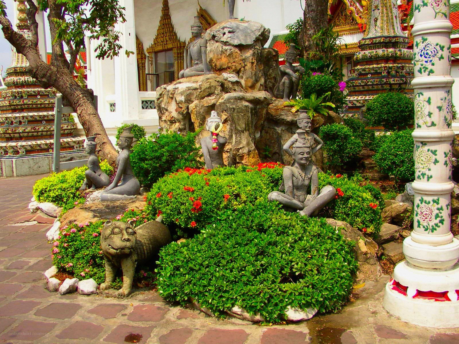 Garden with stone statues and temple