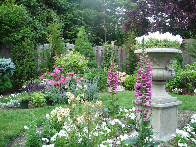 Garden with stone urn and flowers
