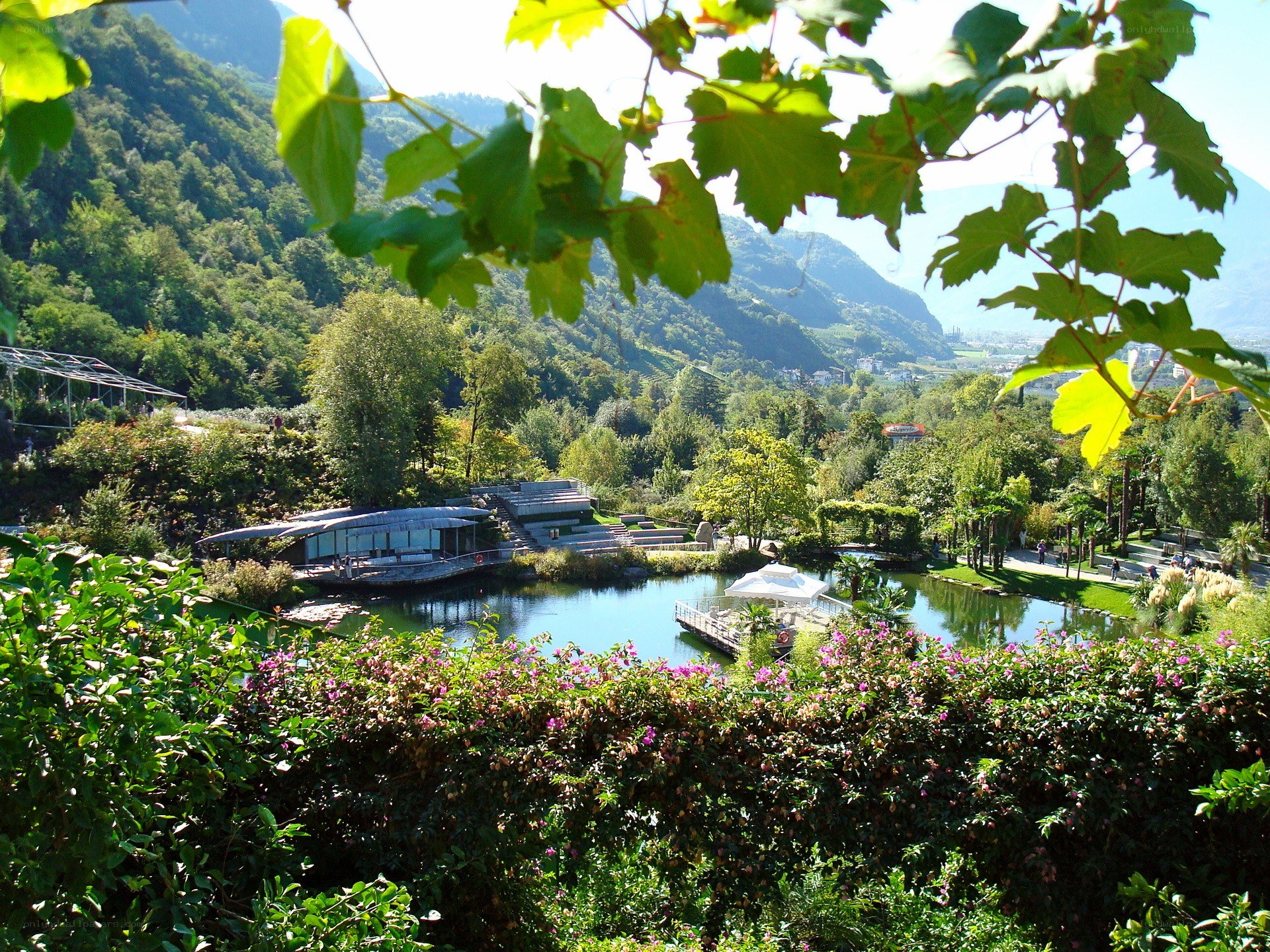 Gardens by a lake with mountains