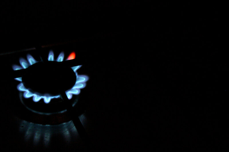 gas stove burner lit at night