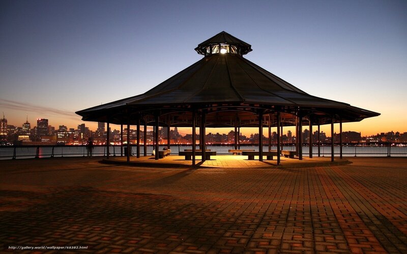 Gazebo at dusk with city skyline