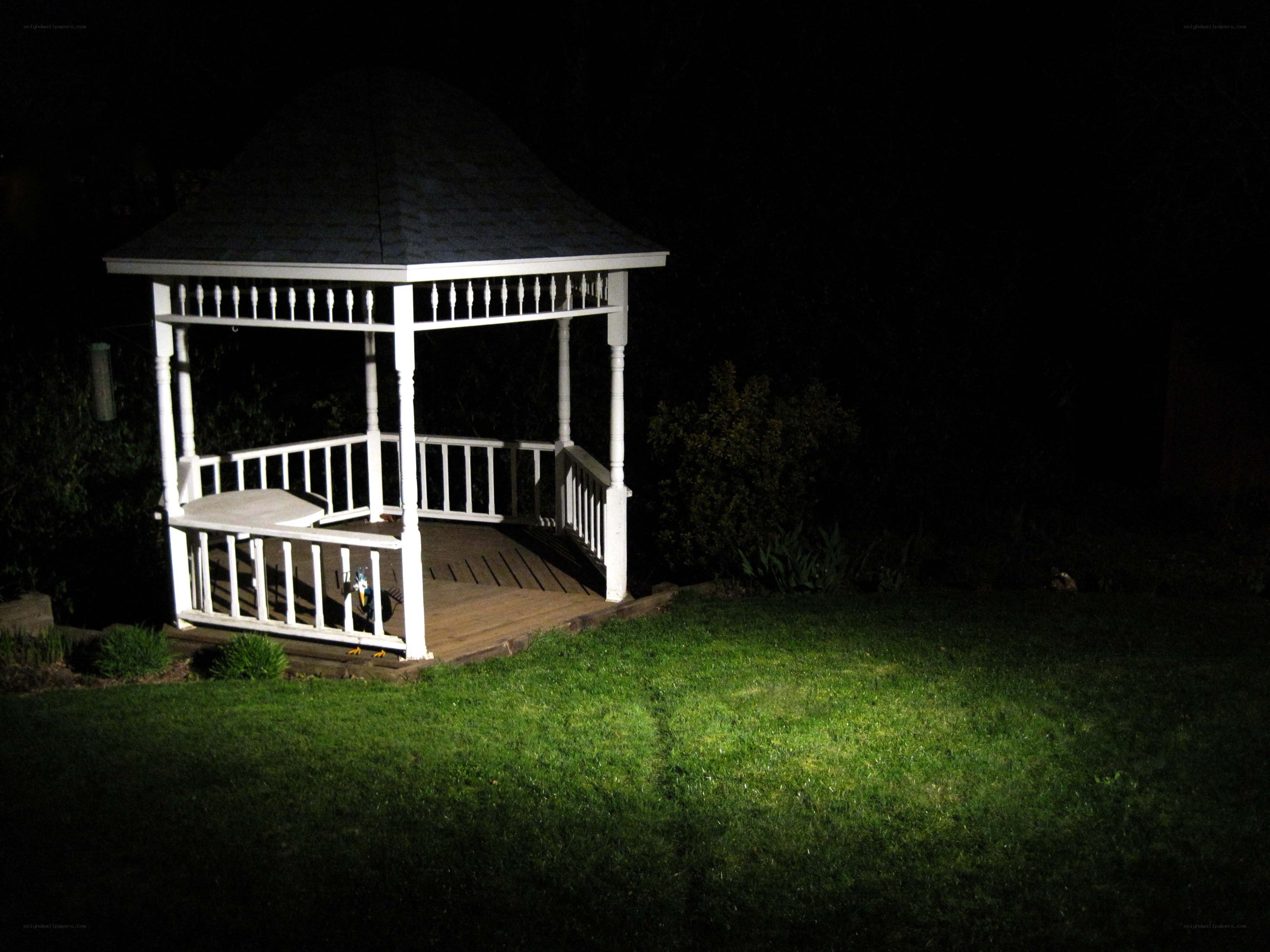 Gazebo at night in backyard