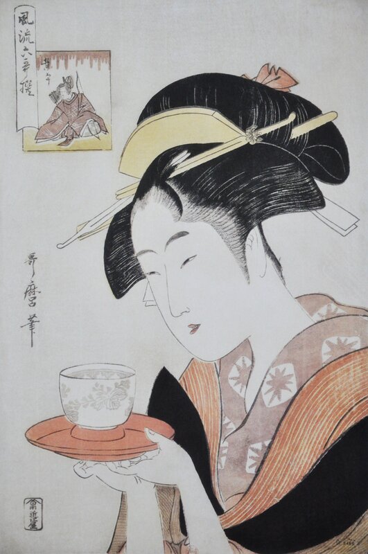 Geisha holding a tea cup