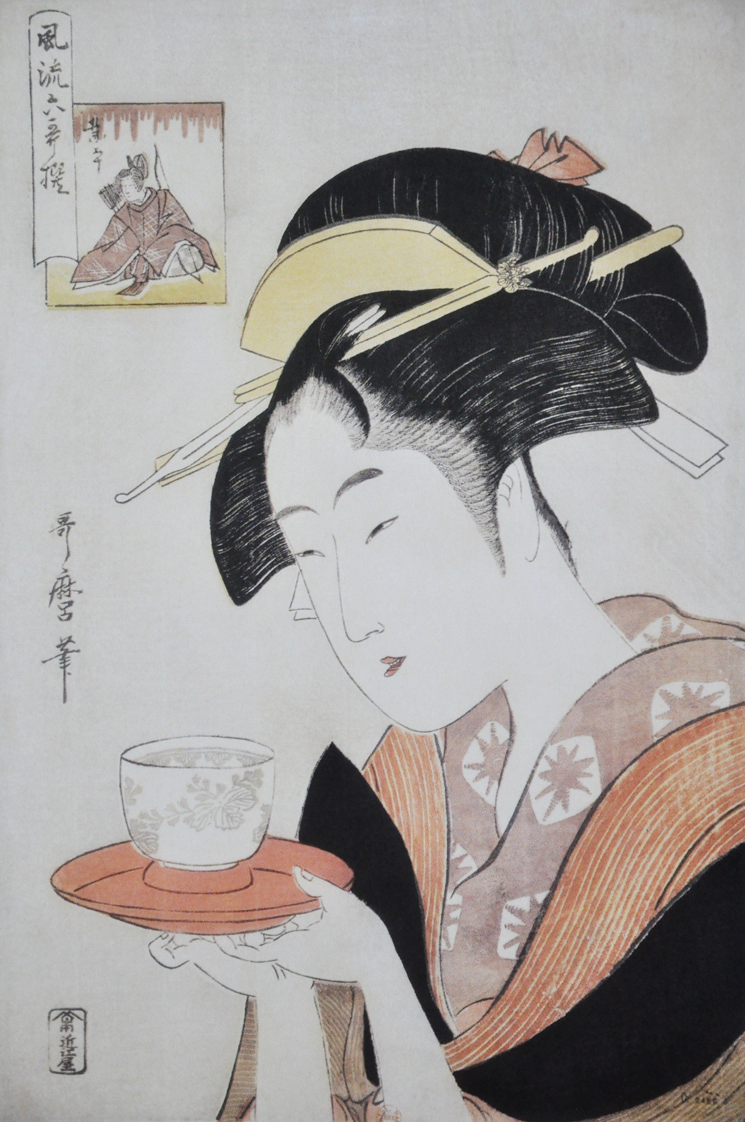 Geisha holding a tea cup