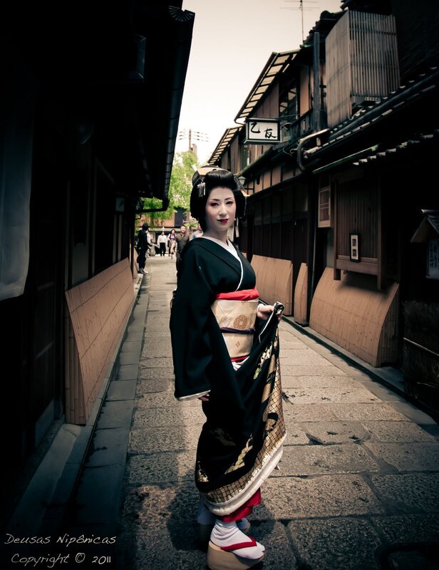 Geisha in a traditional alley