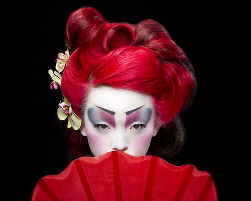 Geisha with red hair and fan