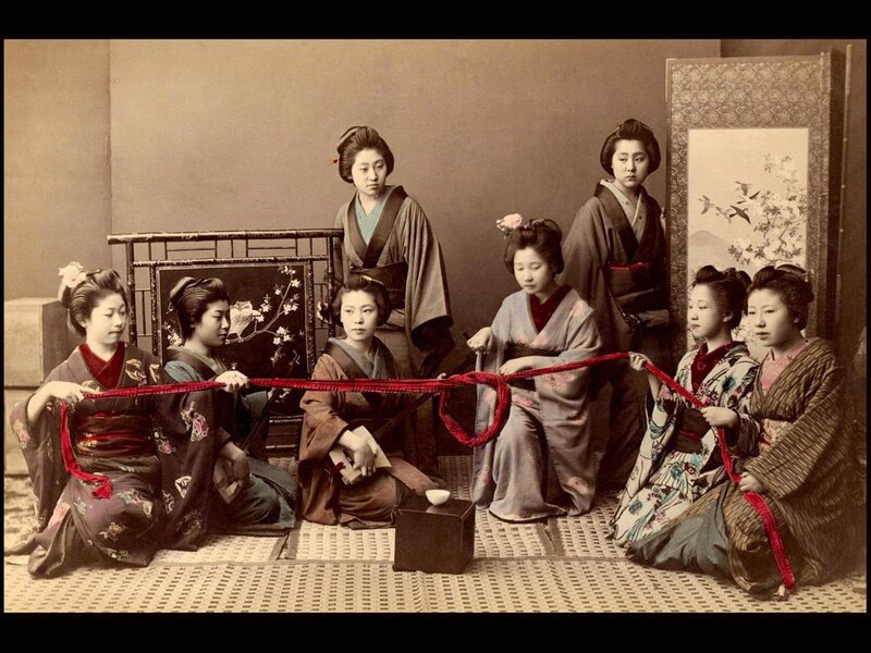 Geishas Holding Red Ribbon