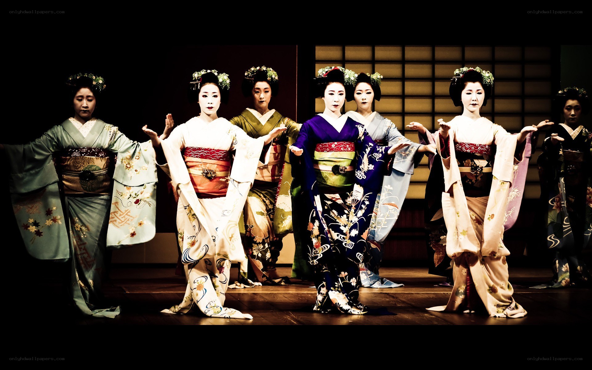 Geishas performing on stage