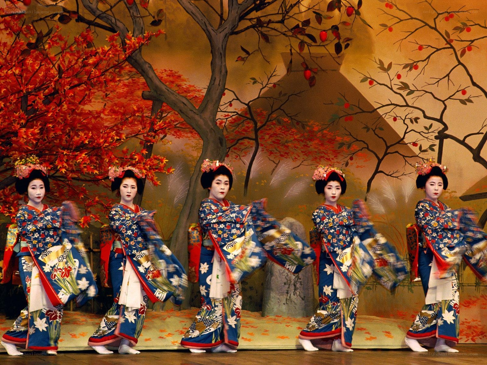 Geishas performing on stage