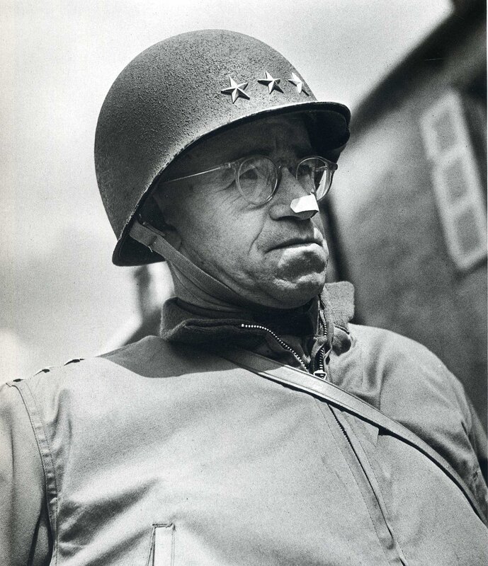 General in helmet with bandage