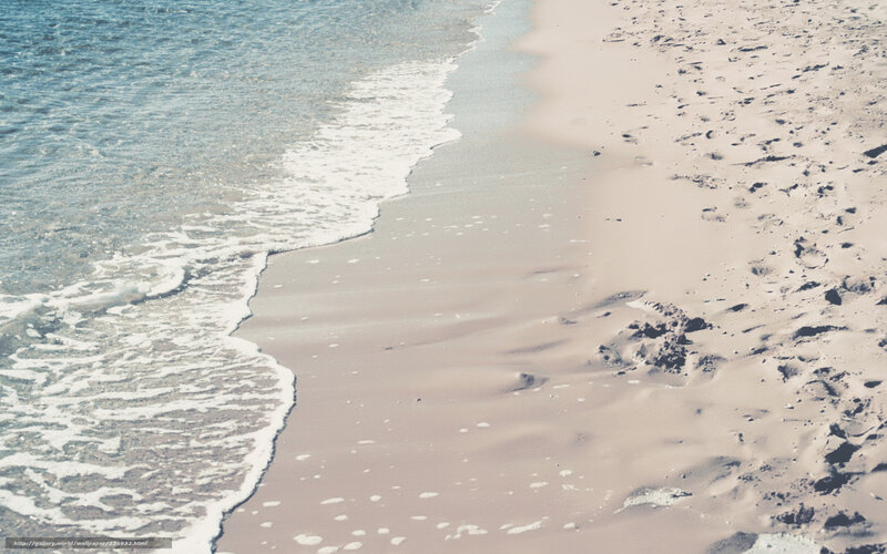 gentle waves on sandy beach