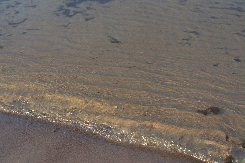 gentle waves on sandy shore