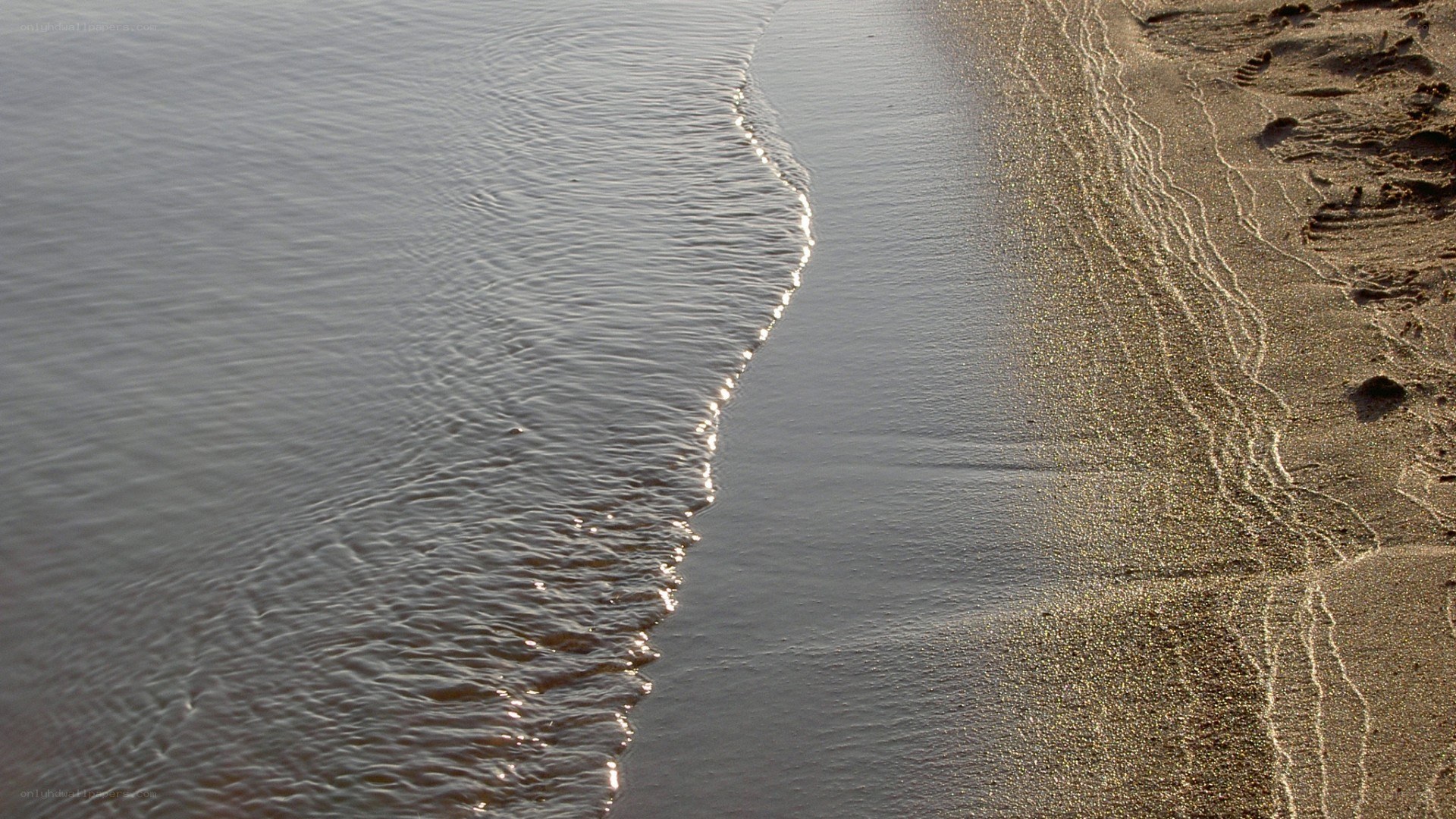 gentle waves on sandy shore