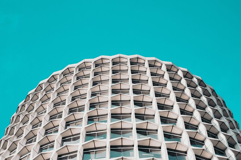 Geometric Building Facade — Cyan