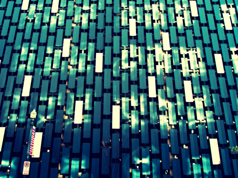 Geometric facade with green panels