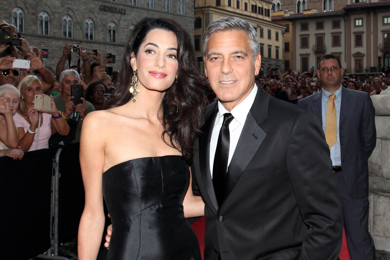 George and Amal Clooney at event