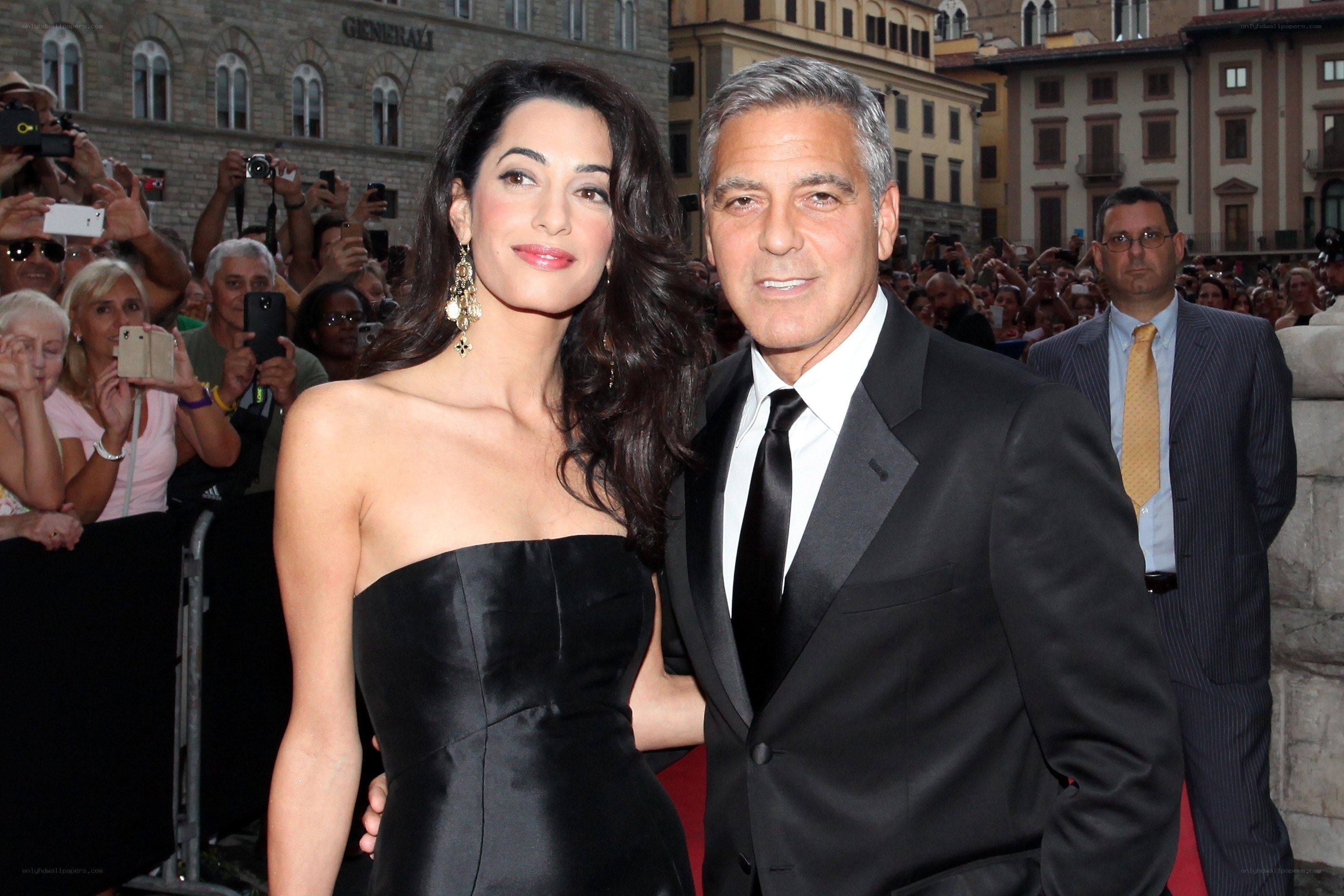 George and Amal Clooney at event