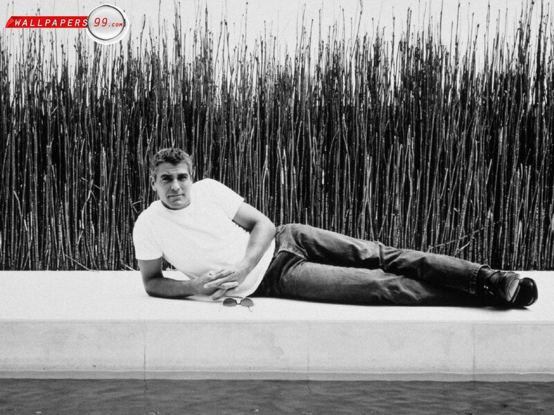 George Clooney lying on a wall