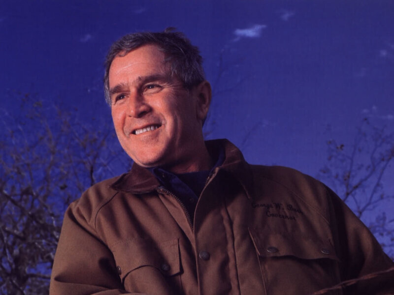 George W. Bush smiling outdoors