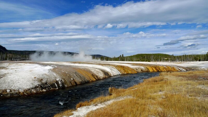 geothermal area with steam and river