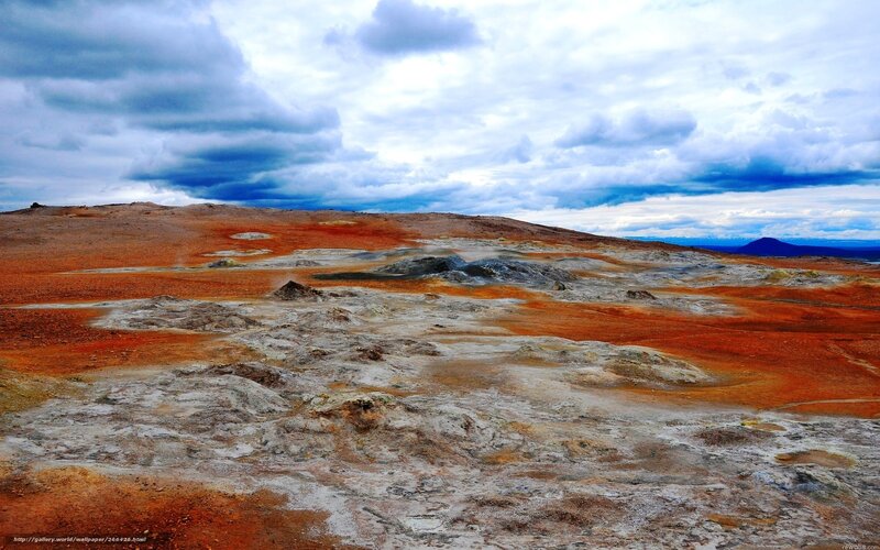 Geothermal landscape under cloudy sky