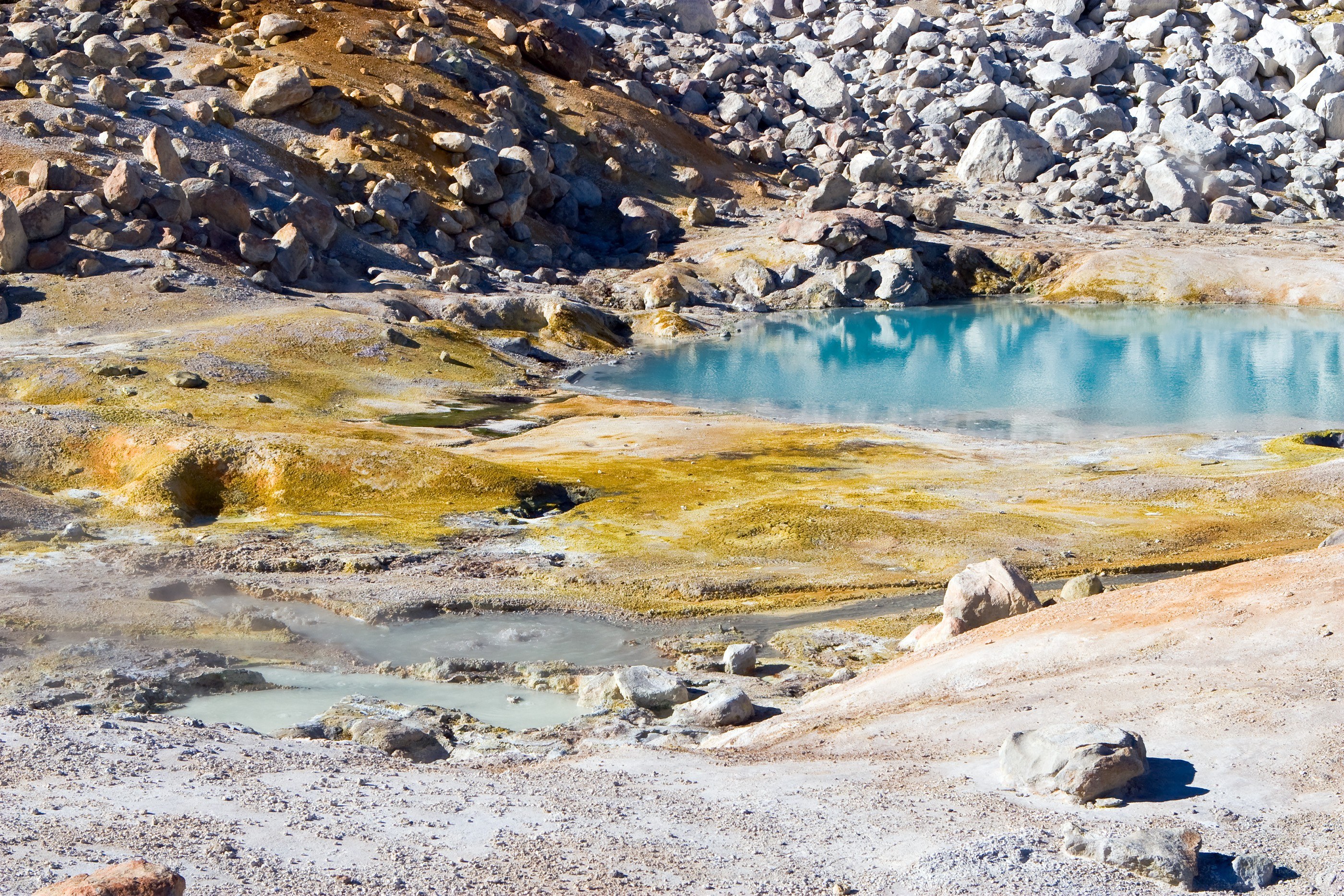 Geothermal pool in volcanic landscape