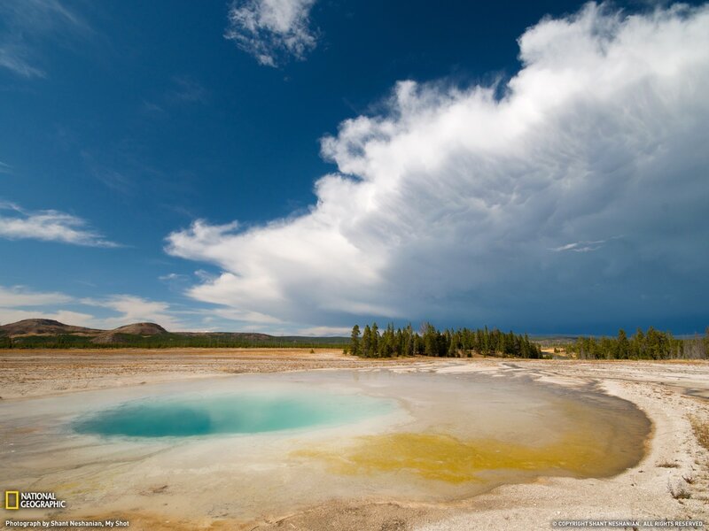Geothermal Pool Under Stormy Sky