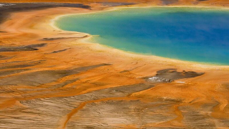 Geothermal pool with colorful mineral deposits