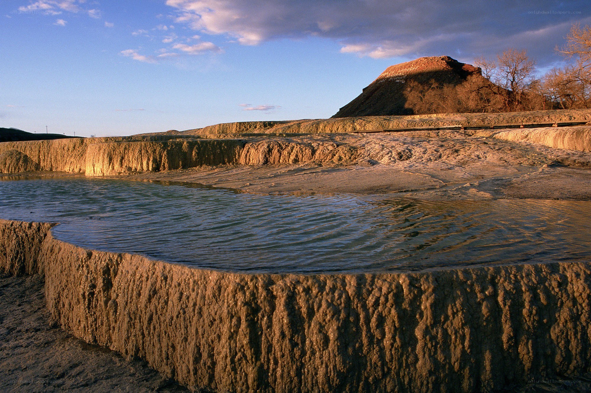 geothermal terraces at sunset