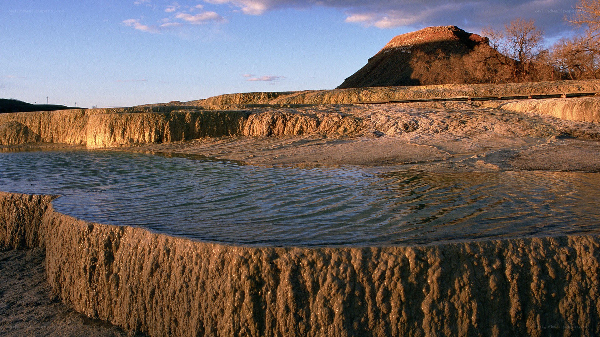 geothermal terraces at sunset