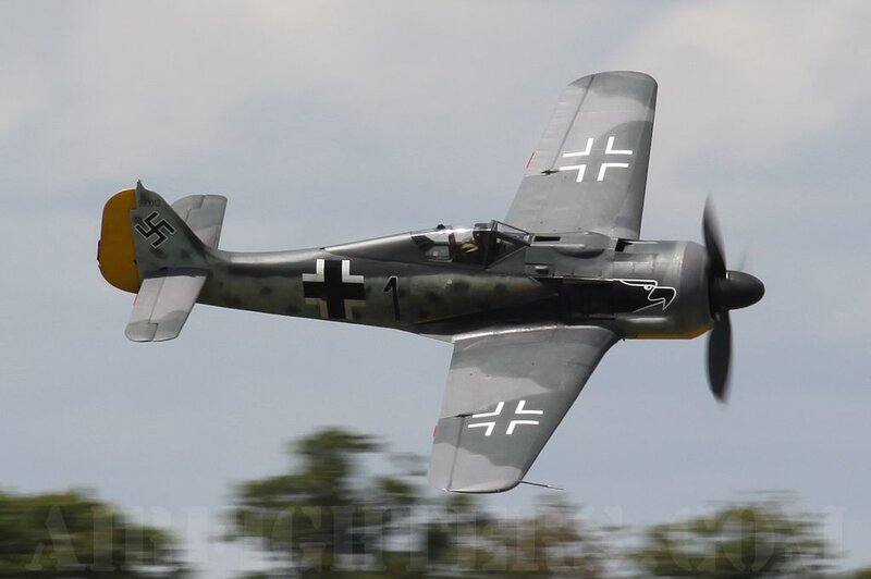 German Fighter Plane — Gray, Dynamic, Afternoon, Photograph, Propeller, Cross Insignia
