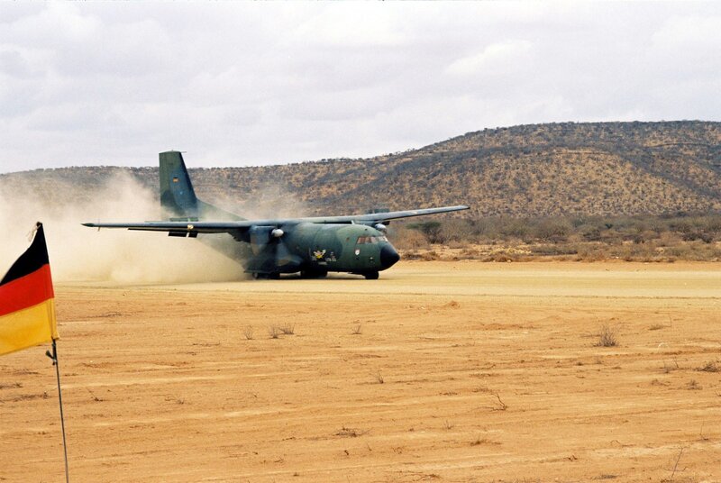 German military plane on dirt runway